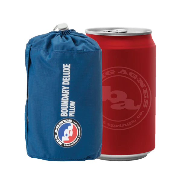 the pillow stuffed, next to  12 ounce can. It's about the same size