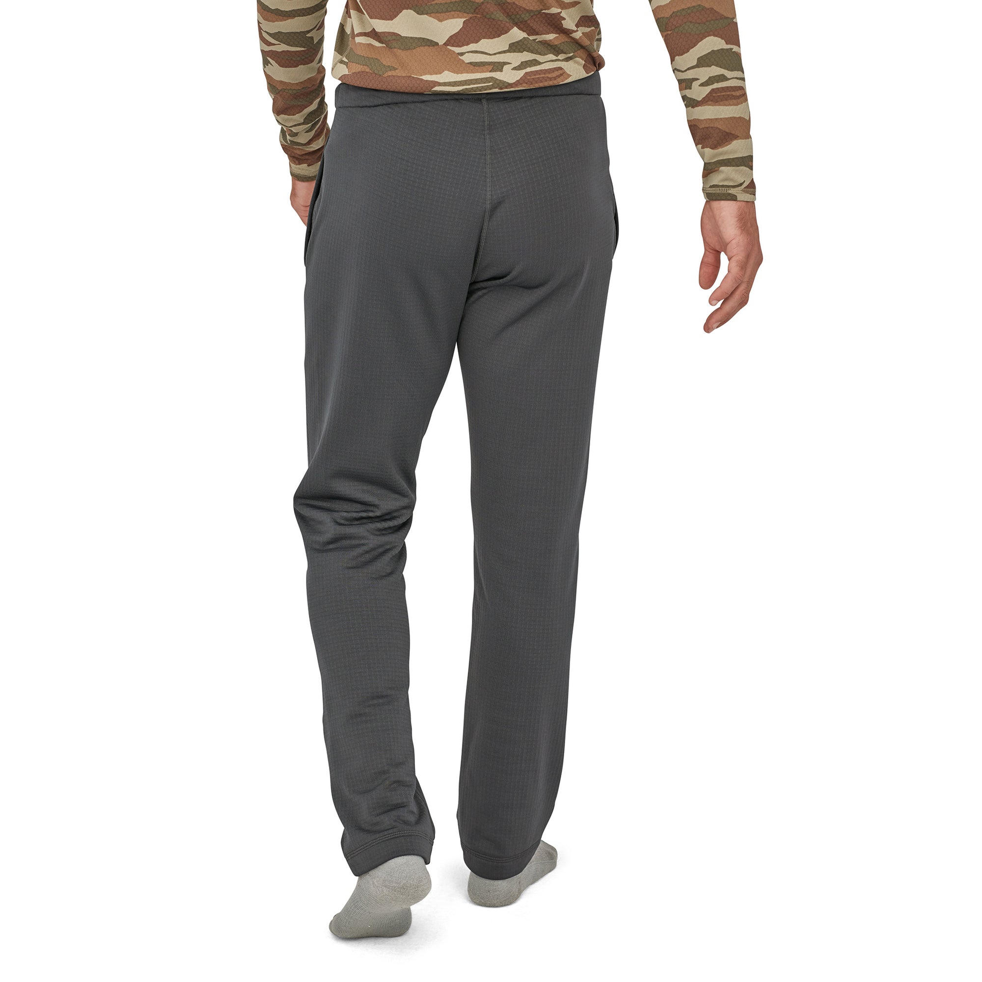 patagonia mens r1 pants in forge grey, back view on a model