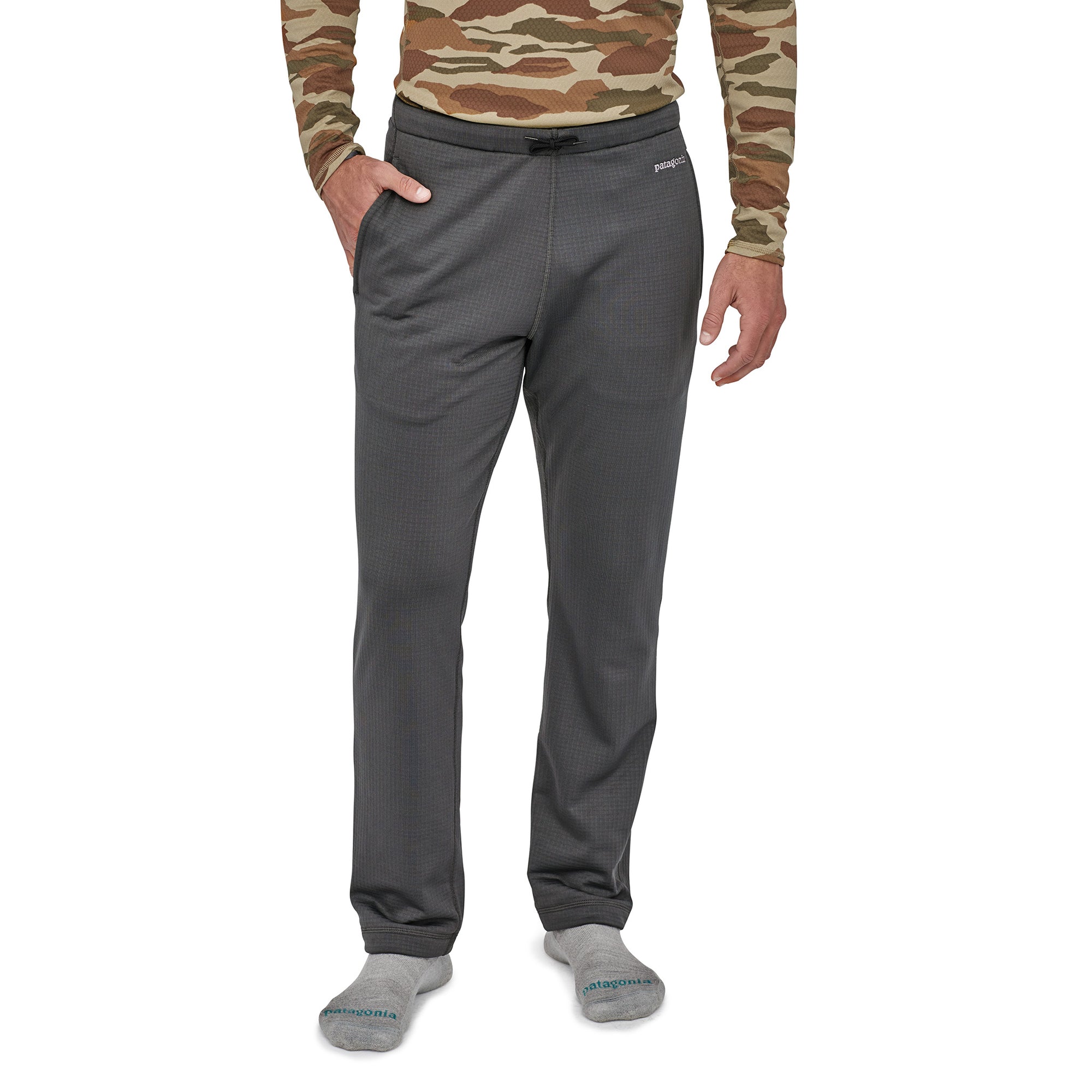 patagonia mens r1 pants in forge grey, front view on a model