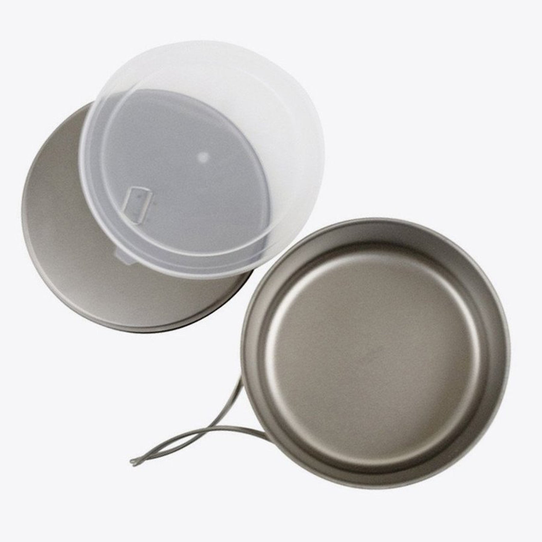 the set showing the pot without lid, the plastic lid, and the metal lid