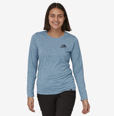 patagonia womens long sleeved capilene cool daily graphic shirt in skyline stencil: steam blue x dye, front view on a model