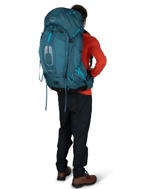 osprey atmos ag 65 in venturi blue, back view on a model