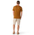 a photo of the smartwool mens classic all season merino short sleeve shirt in the color fox brown, back view on a model