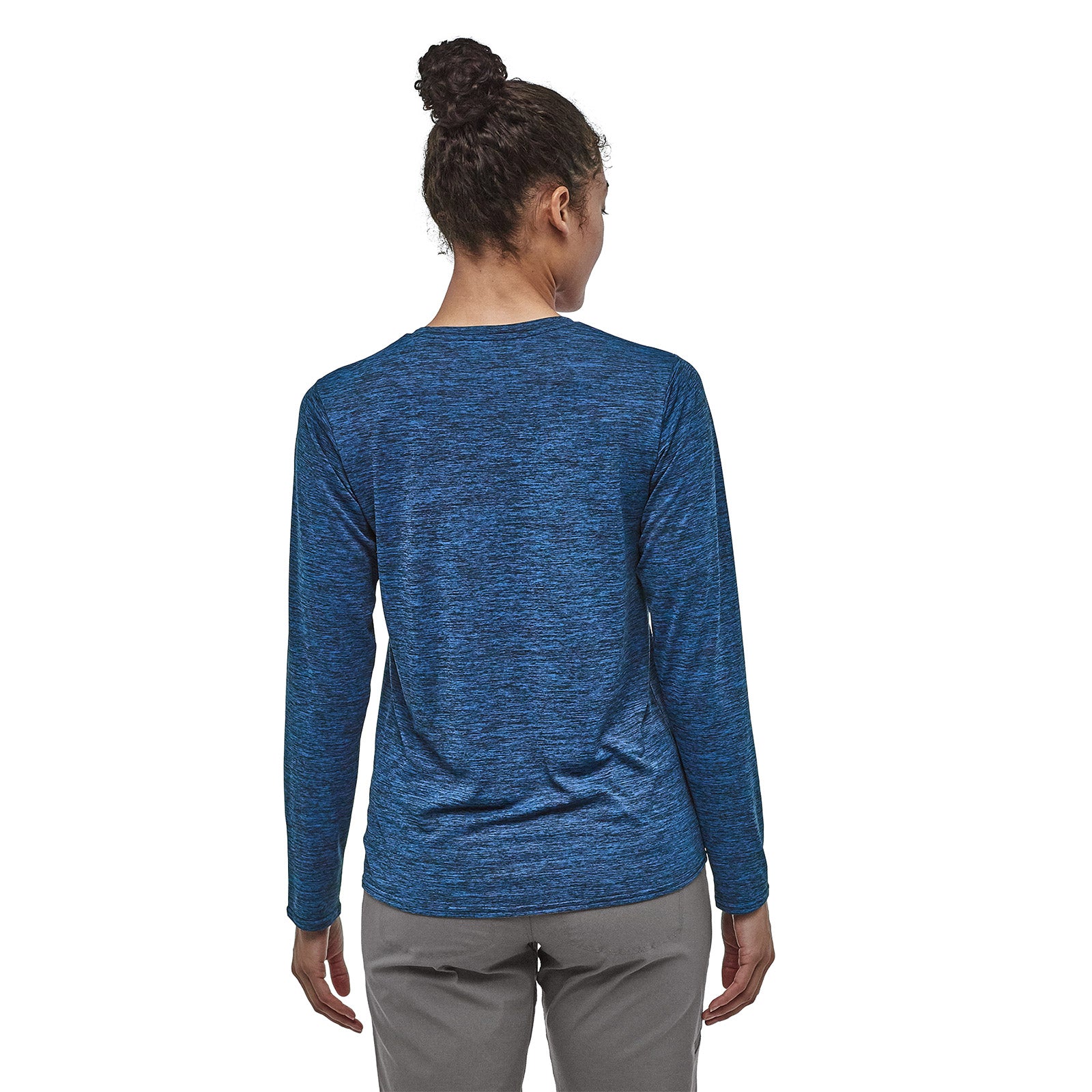 patagonia womens long sleeve capilene daily shirt in viking blue - navy blue x dye, back view on a model
