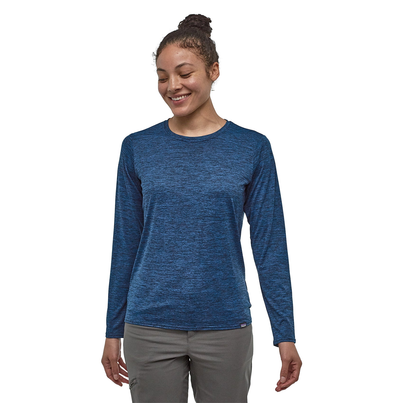 patagonia womens long sleeve capilene daily shirt in viking blue - navy blue x dye, front view on a model