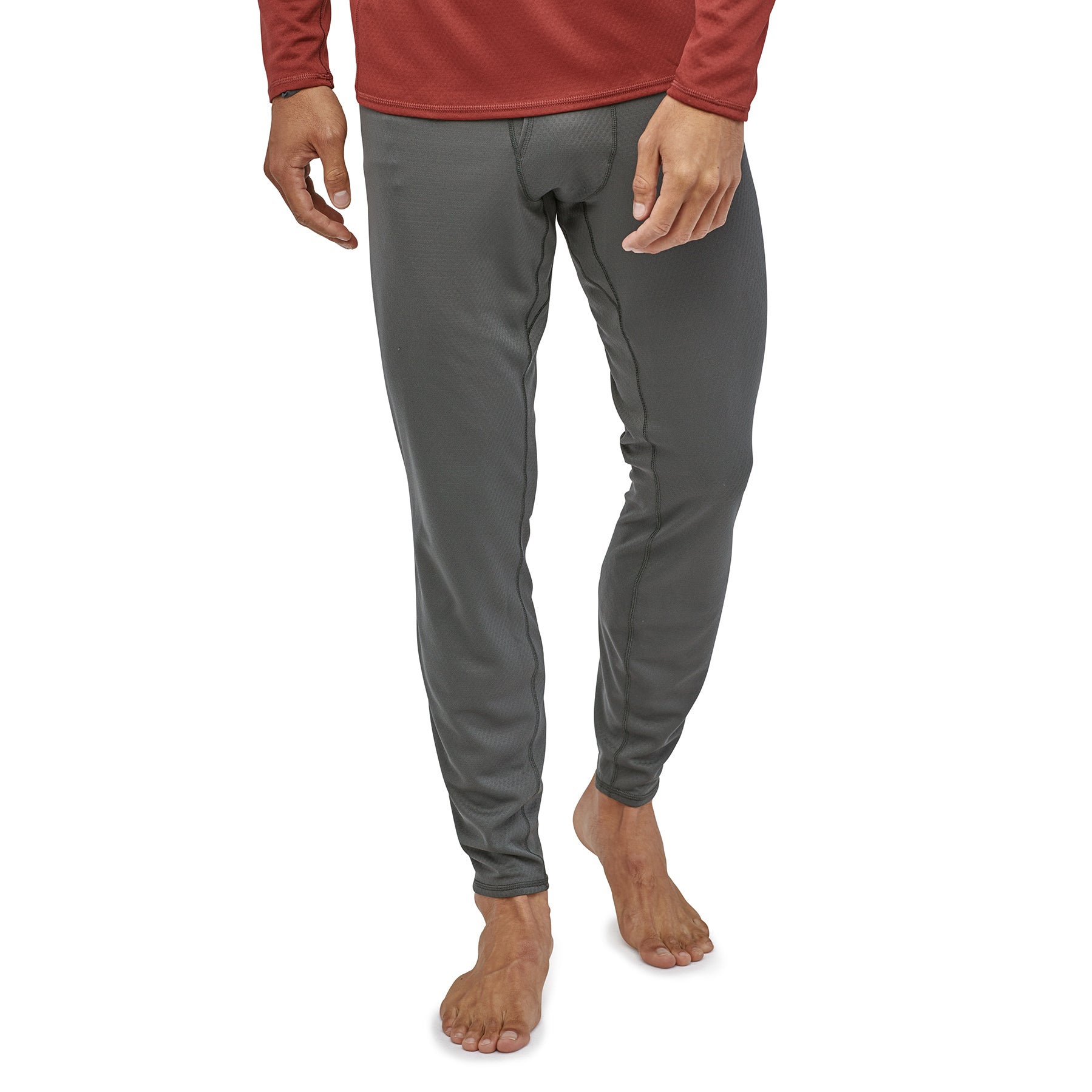 patagonia men's capilene midweight bottoms in forge grey on model