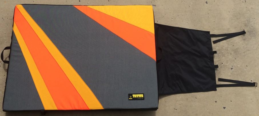 a photo of an organic climbing full pad in orange and grey