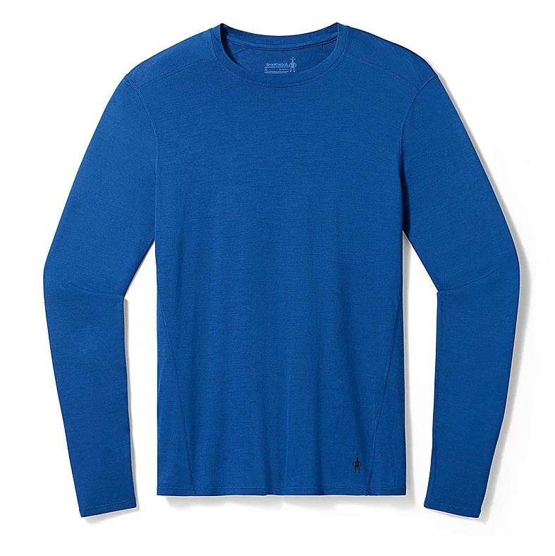 a photo of the smartwool mens classic all season plant based dye merino base layer long sleeve in the color indigo blue, front view