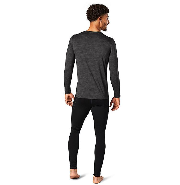 a photo of the men's smartwool classic all season merione base layer long sleeve in the color iron heather, back view on a model