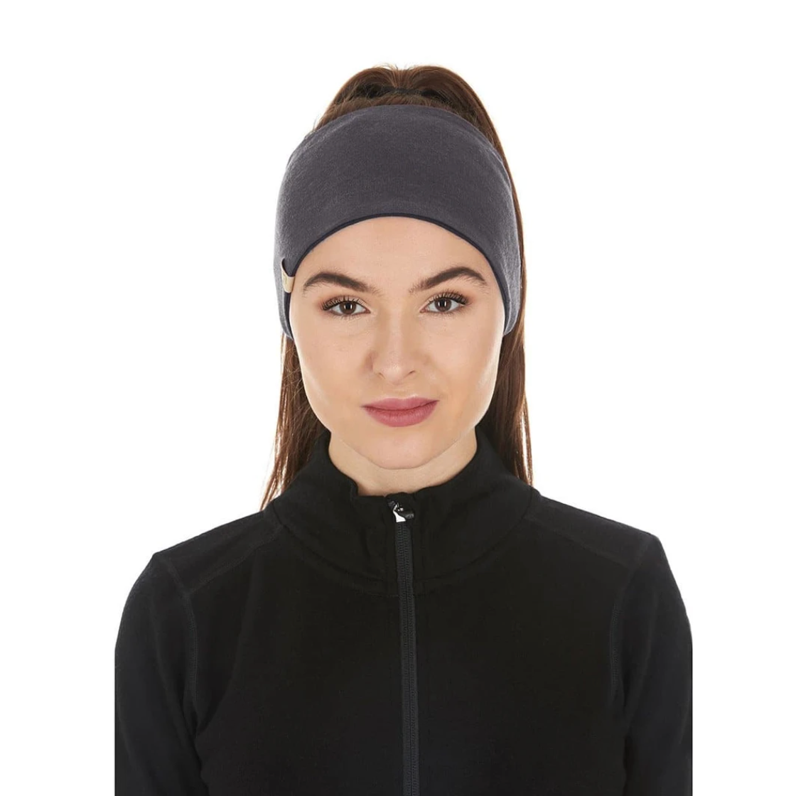 minus33 merino wool reversible headband in black and charcoal on model