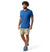a photo of the smartwool mens merino plant based dye short sleeve tee shirt in the color indigo blue, front view on a model