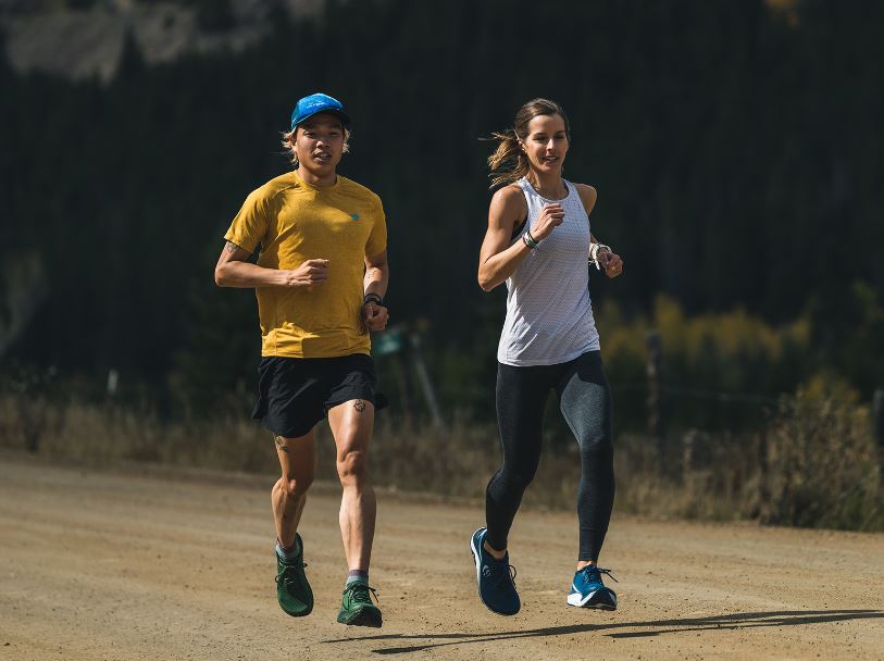 a photo of a man and a women running in the topo ultraventure 3