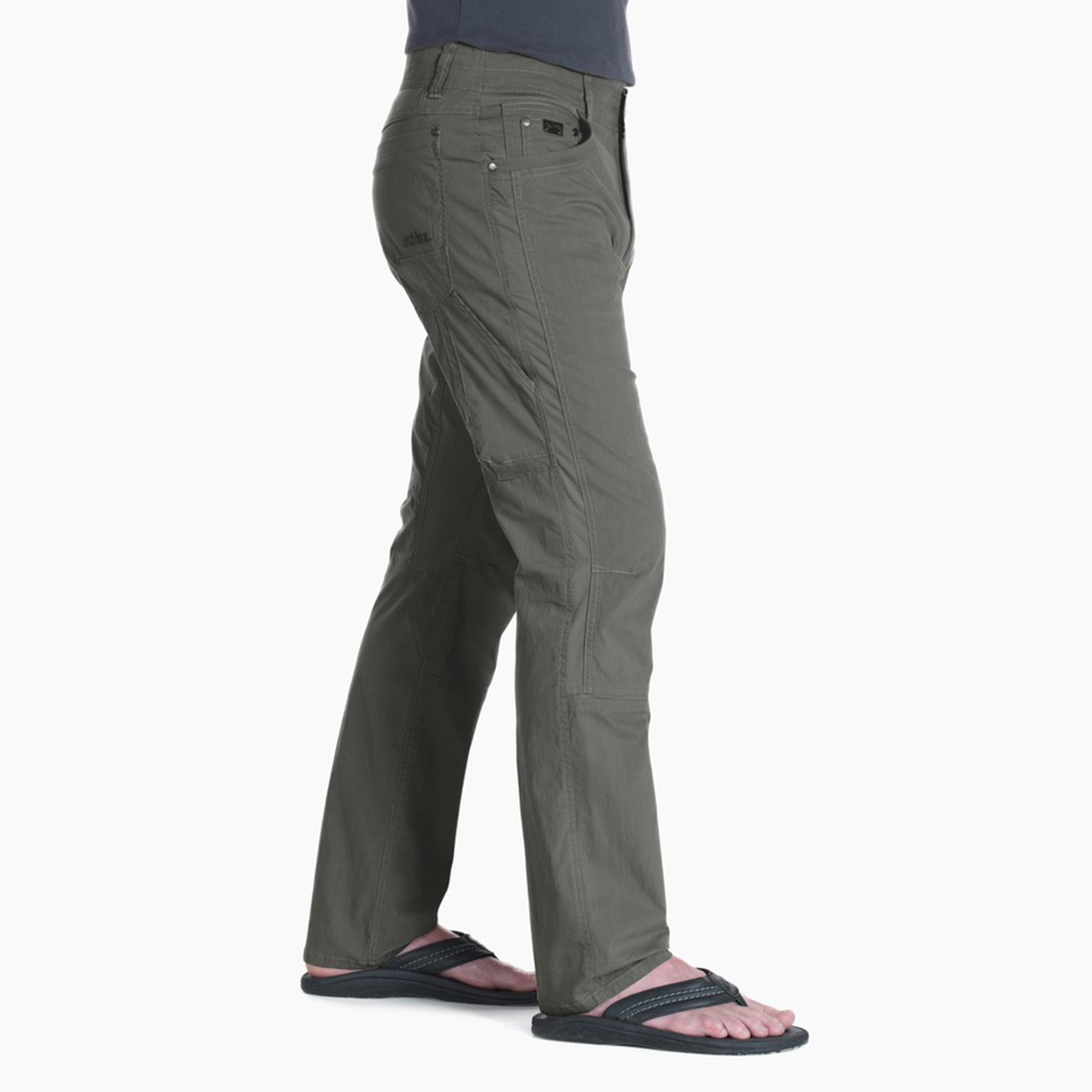 kuhl radikl pants mens on model side view in color green