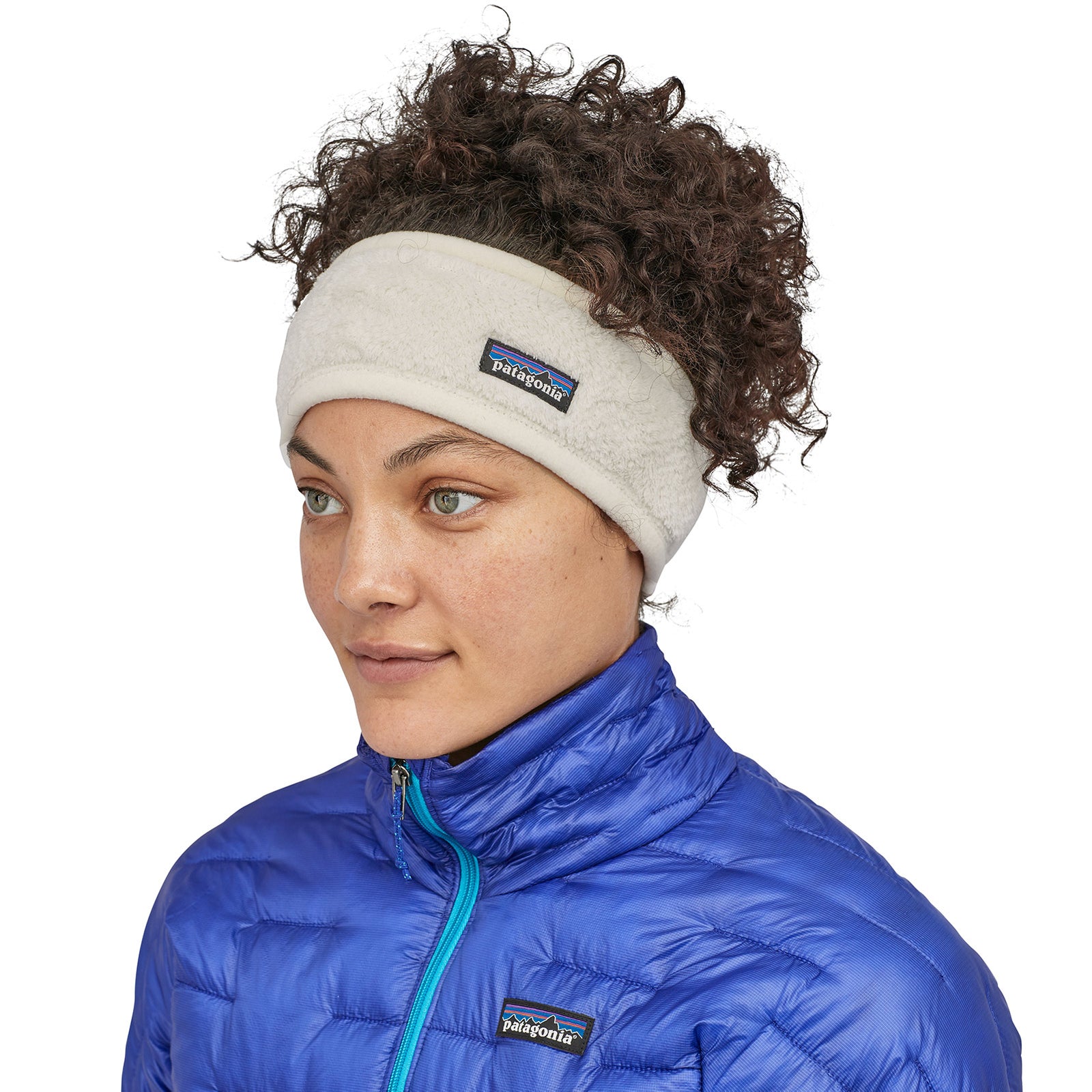 a model wears the retool headband and a puffy jacket